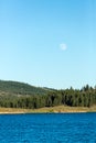 Frenchman lake at sunset land and water with full moon in the sky