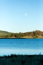 Frenchman lake at sunset land and water with full moon in the sky