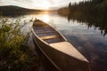 Frenchman Lake Yukon Canada canoe sunset scene Royalty Free Stock Photo