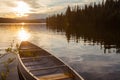 Frenchman Lake Yukon Canada canoe sunset scene Royalty Free Stock Photo