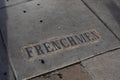 Frenchmen Street plaque embedded in sidewalk