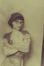 Frenchwoman beret, vintage dress and wearing glasses. Retro toni