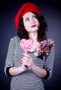 Frenchwoman with pink spiral lollipops