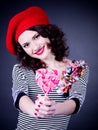 Frenchwoman with pink spiral lollipops