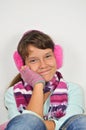 Frendly girl with ear muffs and trimmed gloves