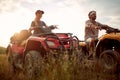 Frends enjoying extreme riding.Young couple enjoying a quad vehicle