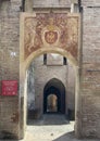 Fresco with coat of arms over the entrance to the Fortress of Vignola near Modena, Italy.