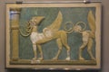 The fresco of high-relief Griffins tethered to columns decorated the ``Great East Hall`` of the palace of Knossos. The decorat