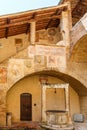 Fresco paintings on a staircase in an Italian courtyard