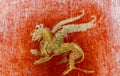 Fresco in Pompeii with winged griffin on a red background Pompeian. Royalty Free Stock Photo