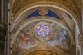 Fresco and stained glass window on the interior of Lucca Cathedral. Cattedrale di San Martino. Tuscany. Italy. Royalty Free Stock Photo