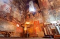 Fresco wall and candle lights inside the hall of Church of the Archangels, Georgia. Royalty Free Stock Photo