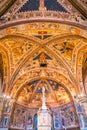 Frescoes and The baptismal font inside the Siena Baptistery of San Giovanni