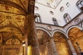 Frescoes decorating the courtyard Palazzo Vecchio. People visit the luxury palace of the Renaissance. Ornate courtyard of Palazzo Royalty Free Stock Photo