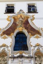Frescoes and stucco on the front of building
