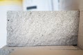 Fresh aerated concrete brick in the cut close-up. The porous structure of the gas block. Universal lightweight building material. Royalty Free Stock Photo