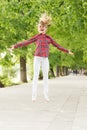 Fresh air gives her the vital energy. High energy or hyperactive kid. Small girl jumping in casual fit for energetic Royalty Free Stock Photo