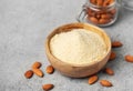 Fresh almond flour in a bowl and almonds