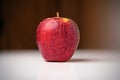 Fresh Apple Alone on top of white table Royalty Free Stock Photo