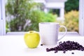 Fresh apple with coffee in a mug and measuring tape on a table. diet concept and healthy. Royalty Free Stock Photo