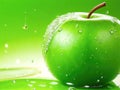 Fresh apple green with water drops. Ripe tasty green apple. Bright colors Royalty Free Stock Photo