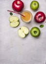 Fresh apple juice from apples of different varieties border ,place for text wooden rustic background top view close up Royalty Free Stock Photo