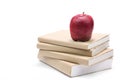 Fresh apple on stack of old books Royalty Free Stock Photo