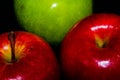 Apples on black backgroundgreen and red Apple on a black background Wallpapers, healthy food Royalty Free Stock Photo