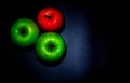 apples on black backgroundgreen and red Apple on a black background Wallpapers, healthy food Royalty Free Stock Photo