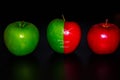 Apples on black backgroundgreen and red Apple on a black background Wallpapers, healthy food Royalty Free Stock Photo