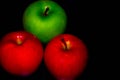 Apples on black backgroundgreen and red Apple on a black background Wallpapers, healthy food Royalty Free Stock Photo