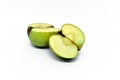 Fresh apples are cut in half, oranges and grapes isolated on white background