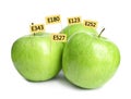 Fresh apples with E numbers on background. Harmful food additives Royalty Free Stock Photo