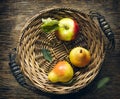 Fresh apples and pears in wicker tray Royalty Free Stock Photo