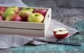 Fresh apples in a tray on a wooden background. Apples are red, green, yellow. Healthy Eating Vitamins Vegetarian Royalty Free Stock Photo