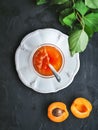 Fresh apricot cut in half and apricot jam in jar Royalty Free Stock Photo