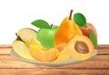 Fresh apricot, peach, apple and pear on wooden plate isolated on Royalty Free Stock Photo