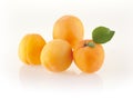 Fresh apricots with leaves on white background Royalty Free Stock Photo