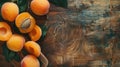 Fresh apricots on rustic wooden background. Top view food photography with natural light Royalty Free Stock Photo