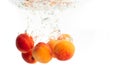 Fresh Apricots with water splash isolated over white background Royalty Free Stock Photo