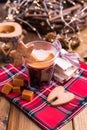 Fresh aromatic coffee and Italian Christmas sweets. Nougat with almonds, karemelnye sweets, ginger cookies and hot drink. Candles Royalty Free Stock Photo