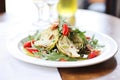 fresh artichoke heart salad with greens and vinaigrette