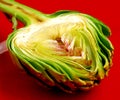 Fresh artichoke on the red plate Royalty Free Stock Photo