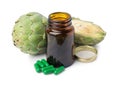 Fresh artichokes and bottle of pills isolated on white Royalty Free Stock Photo