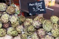 Fresh artichokes at farmers market. Local produce stack or pile for sale at the farmers market Royalty Free Stock Photo