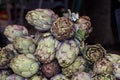 Fresh artichokes at farmers market. Local produce stack or pile for sale at the farmers market Royalty Free Stock Photo