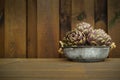 3 fresh artichokes green-purple flower head, on wooden background Royalty Free Stock Photo