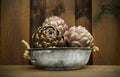 3 fresh artichokes green-purple flower head, on wooden background Royalty Free Stock Photo