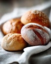 Fresh artisan bread rolls on linen cloth, close-up, studio lighting Royalty Free Stock Photo