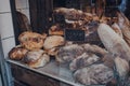 Fresh artisan bread on a window display of a bakery